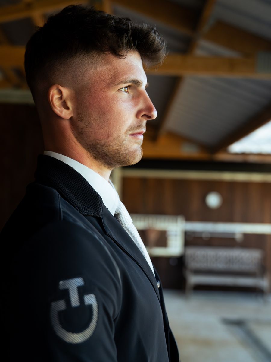 Portrait of the trainer in the stable yard